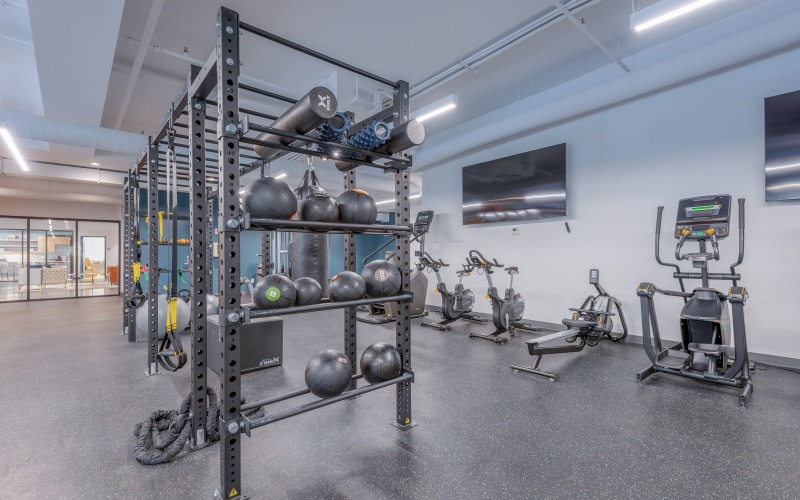 fitness center with weights and cardio equipment